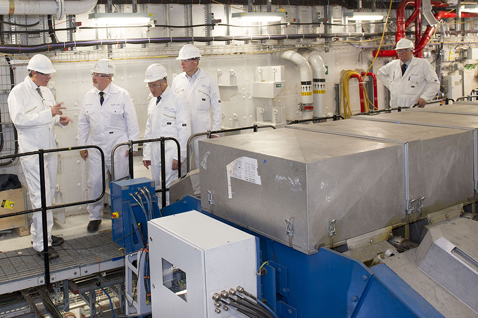 Philip Dunne shown around the diesel engine space on board HMS Queen Elizabeth