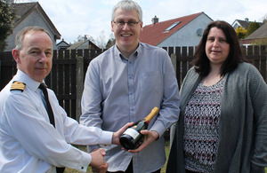 Captain Michael Tarr RN with Petty Officer Mark Trollope and his wife Nic [Picture: Crown copyright]