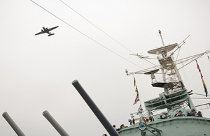 A Second World War Douglas C-47 Dakota military transport aircraft flies over HMS Belfast [Picture: Sergeant Paul Shaw, Crown copyright]