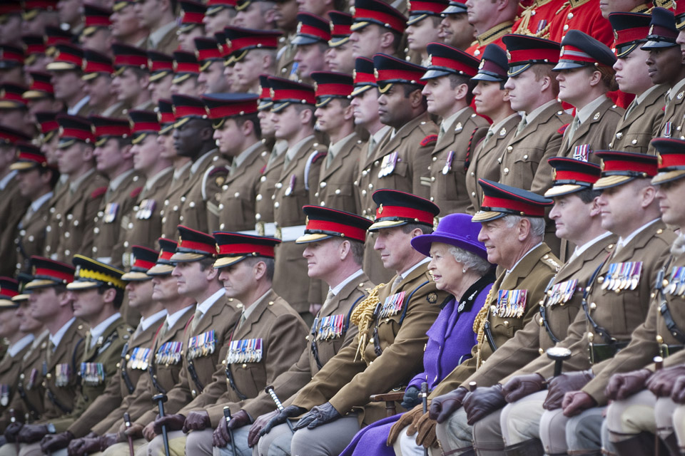 Her Majesty poses for a photograph with members of the Household Cavalry regiments