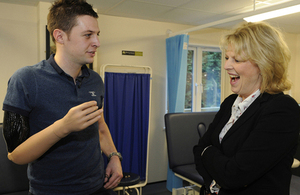 Corporal Andrew Garthwaite demonstrates his 'thought-controlled' prosthetic arm to Defence Minister Anna Soubry [Picture: Sergeant Pete Mobbs, Crown copyright]