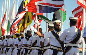 Sailors of the Pakistan Navy conduct the opening ceremony for Exercise Aman with the flags of all participating nations [Picture: Leading Airman (Photographer) Maxine Davies, Crown copyright]