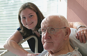Older man in hospital with young relative