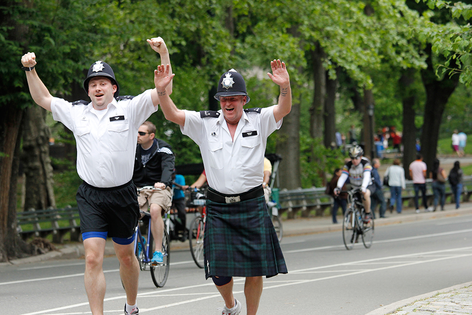 A kilted officer makes his way through Central Park.