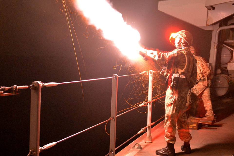 A flare is launched during a night shoot exercise 