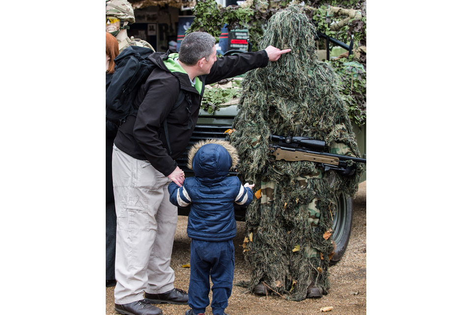 A father and son take a look at a British Army sniper