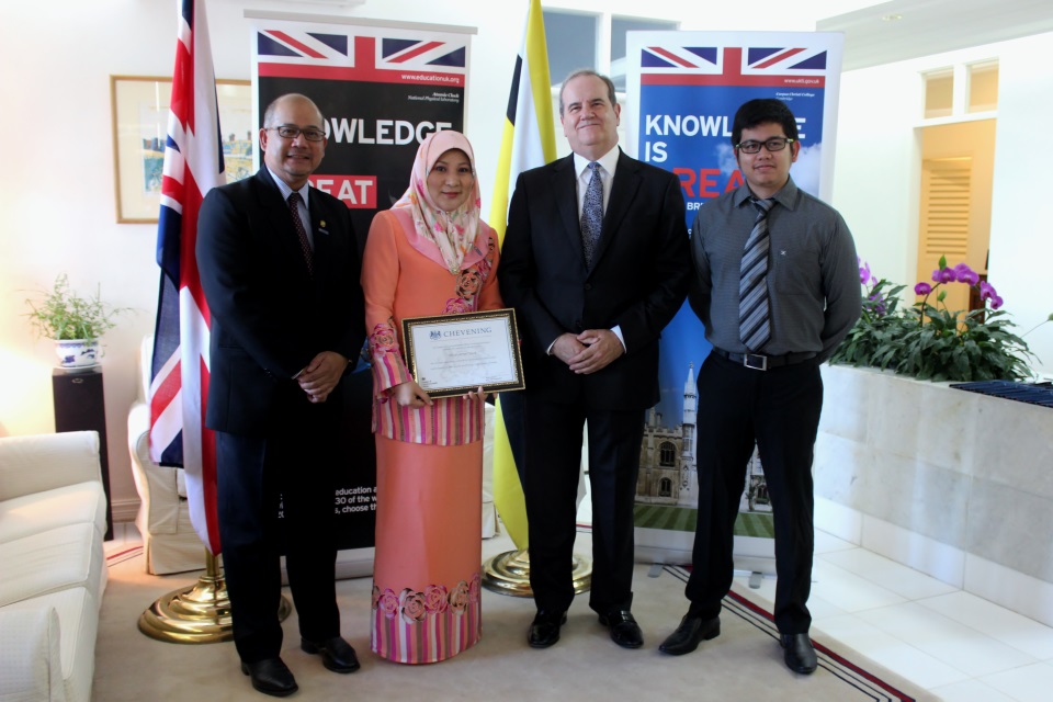 British High Commissioner David Campbell with Senior Superintendent Dinah, her husband Haji Abdul Rahim Derus who was also a Chevening scholar, and their son