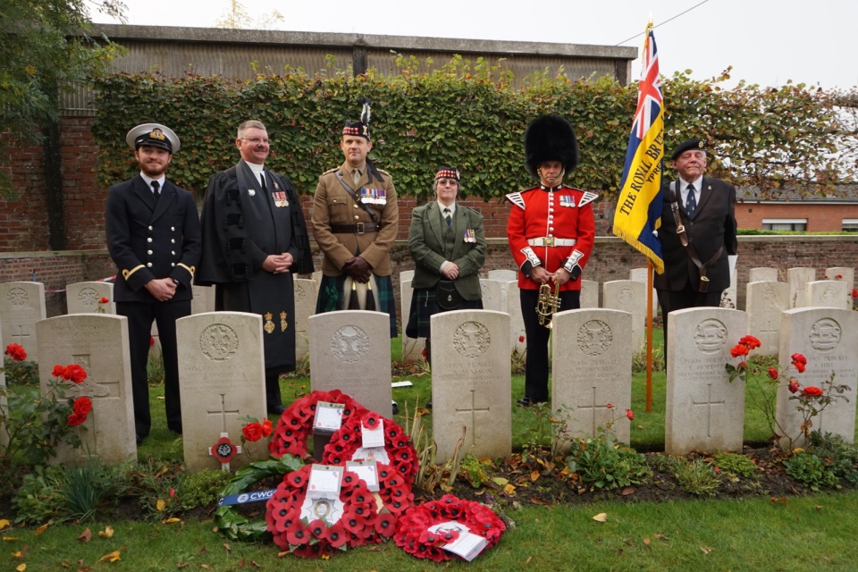 Standing by the graveside of Private Anderson Regimental representatives and a Royal British Legion standard bearer. Crown Copyright. All Rights Reserved.