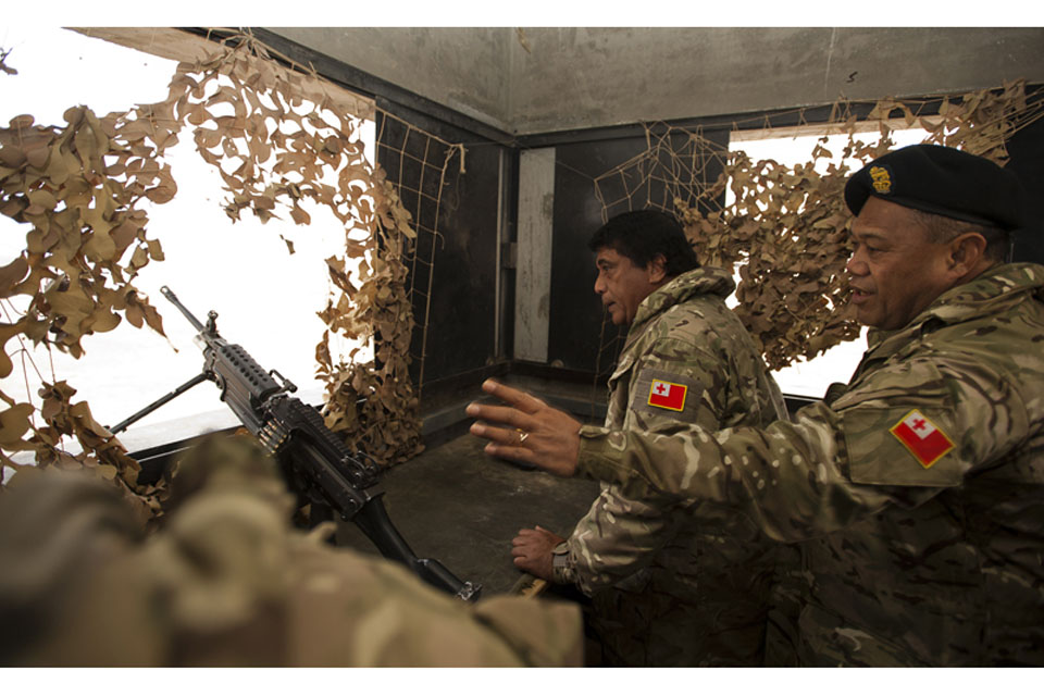 The Tongan Prime Minister, His Excellency Lord Tu'ivakano, visits one of Camp Bastion's perimeter towers to learn about the role of the Tonga Defence Services in providing security for the base 