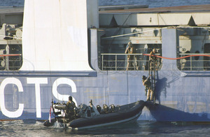 Royal Marines from HMS Montrose board MV Beluga Fortune after an attack by armed pirates in the Indian Ocean
