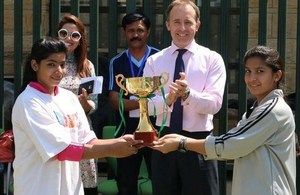 Mr. Thomas Drew CMG, British High Commissioner-Designate, with captains of the under 14 girls football teams