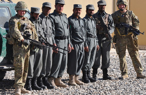 British soldiers pose with some of the Afghan policemen