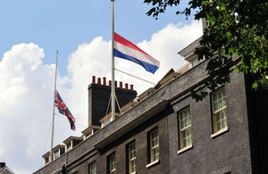 The Union and Dutch flags flying at half-mast over Downing Street