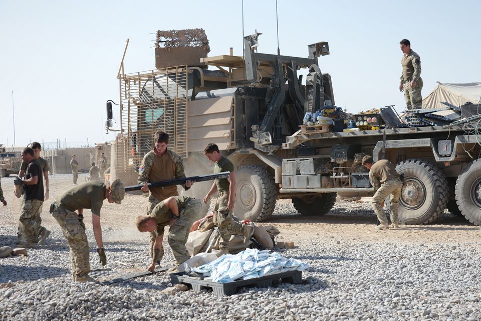 British soldiers load stores onto vehicles