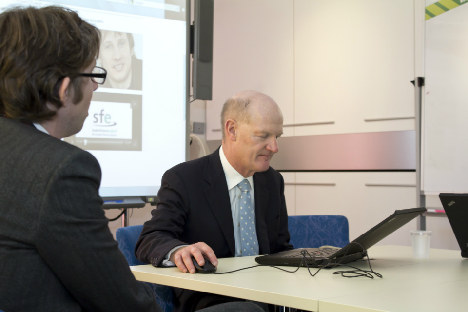 David Willetts completing the online student loan application process