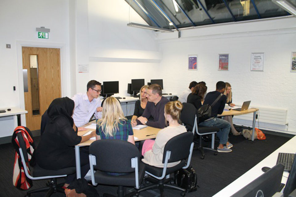 Start Ed students working around table