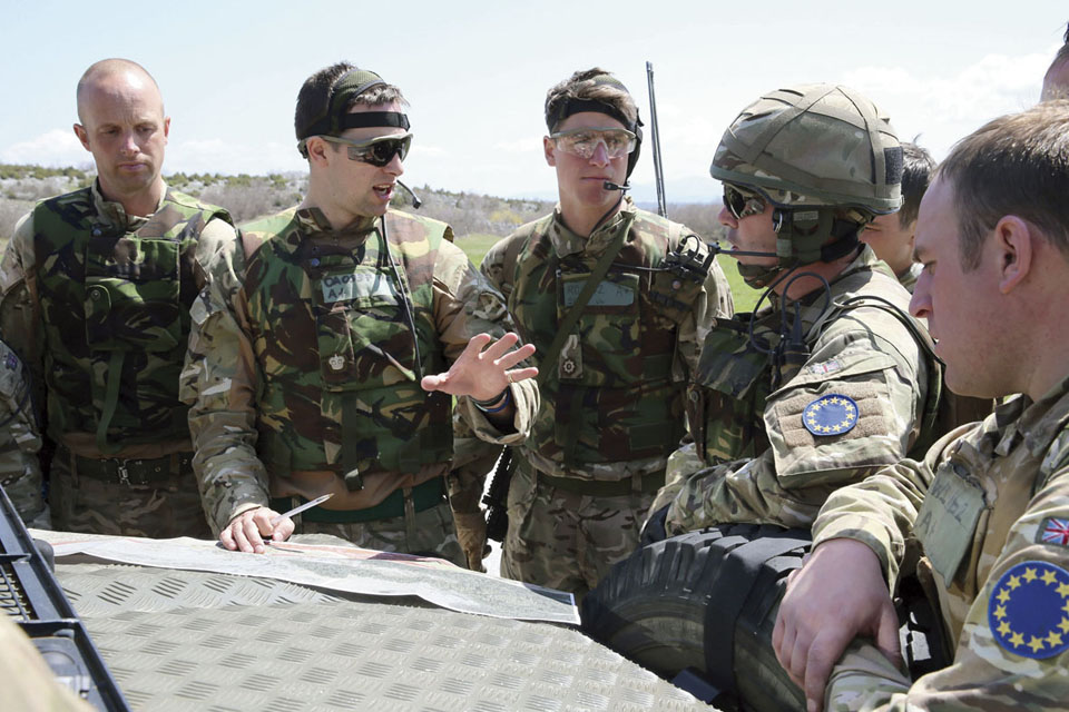 Soldiers of the 1st Battalion Irish Guards plan their mission