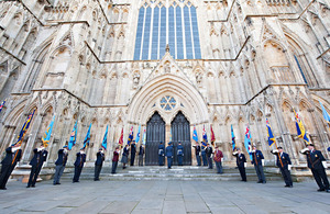 Standard Bearers line the steps leading into York Minster for the unveiling of a memorial to Second World War French airmen