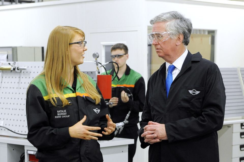 Minister Michael Fallon with Natalie Murray, first-year apprentice, at the MINI Plant Oxford Training School