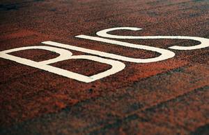 Bus marking on road.