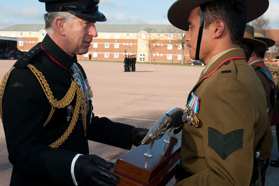 Prince Charles presents Sergeant Bikash Gurung with the Prince of Wales Kukri 