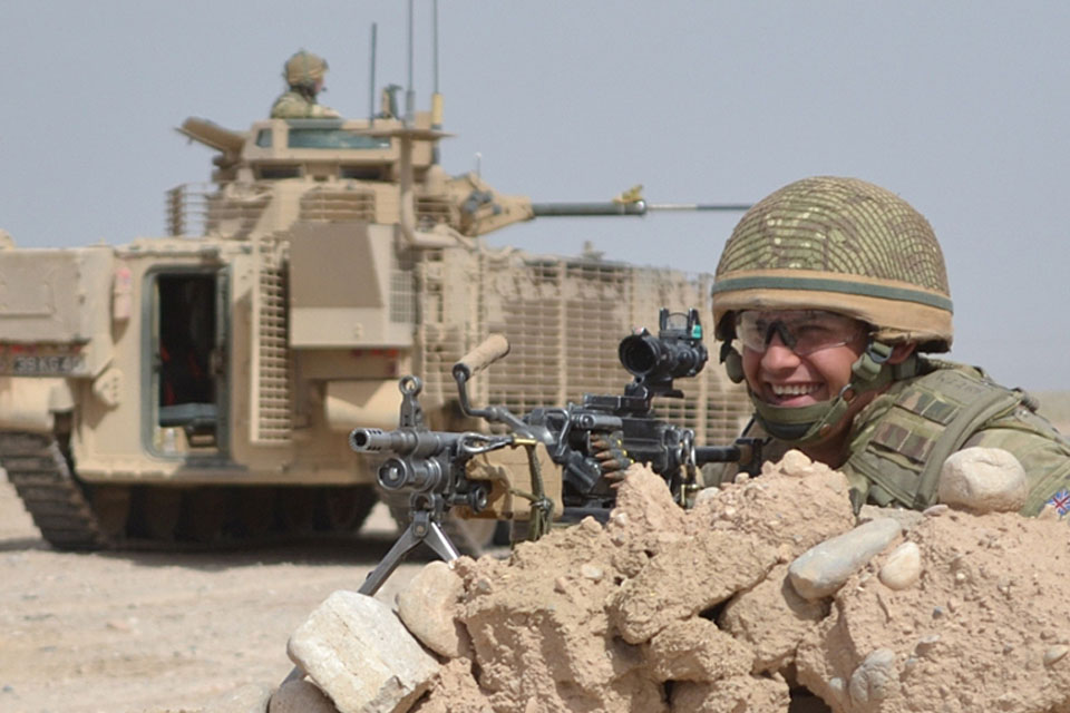 A British soldier with a new, up-armoured Warrior infantry fighting vehicle in Afghanistan 