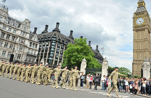 Personnel from 20th Armoured Brigade march to the Palace of Westminster