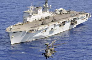 A British Army Apache helicopter takes off from HMS Ocean in the Mediterranean
