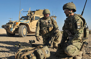 A Rifles reservist serves alongside a regular Army colleague on operations in Helmand province