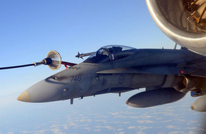 A Canadian F-18 aircraft refuels from a VC10 K3 of 101 Squadron RAF during a mission as part of the NATO-led Operation UNIFIED PROTECTOR