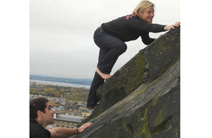 Major Ellen Bruce climbs barefoot up to Edinburgh Castle to mark the beginning of the European Military Climbing Championships