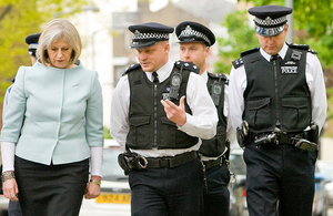 Home Secretary with police