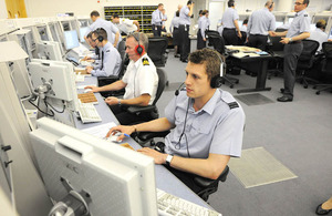 Royal Air Force and Royal Navy air traffic controllers in the new Atlas control room at the Air Traffic Control Centre in Swanwick