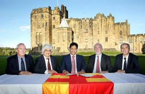 Leaders signing the MOU with Alnwick Castle in the background