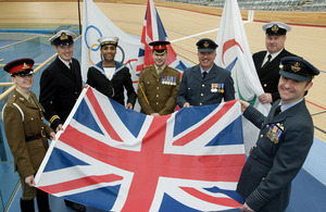 Tri-Service military personnel hold out a Union Flag to promote the Armed Forces' role in the London 2012 Olympic and Paralympic Games which took place this summer