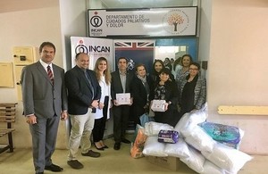 Ambassador Jeremy Hobbs and his wife Eréndira Hobbs delivering donations to the National Cancer Institute