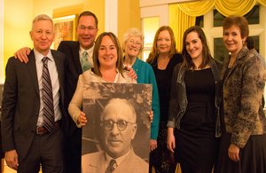 Frank Foley's family holding photo of Frank Foley