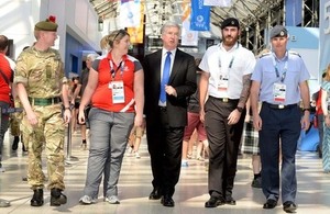 Defence Secretary Michael Fallon with members of the military venue security force supporting the Commonwealth Games [Picture: Mark Owens, Crown copyright]