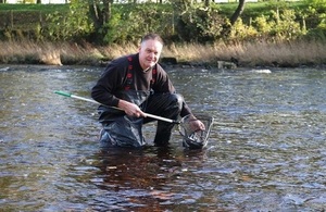 Image shows Paul Frear stocking fish into the Tees