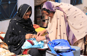 Tahira with a patient and her young child. Picture: Victoria Francis/ DFID