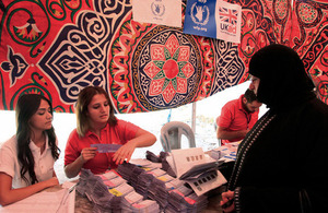 A Syrian refugee woman receives UK-funded food vouchers from WFP in Amman Jordan. Picture: Russell Watkins/DFID