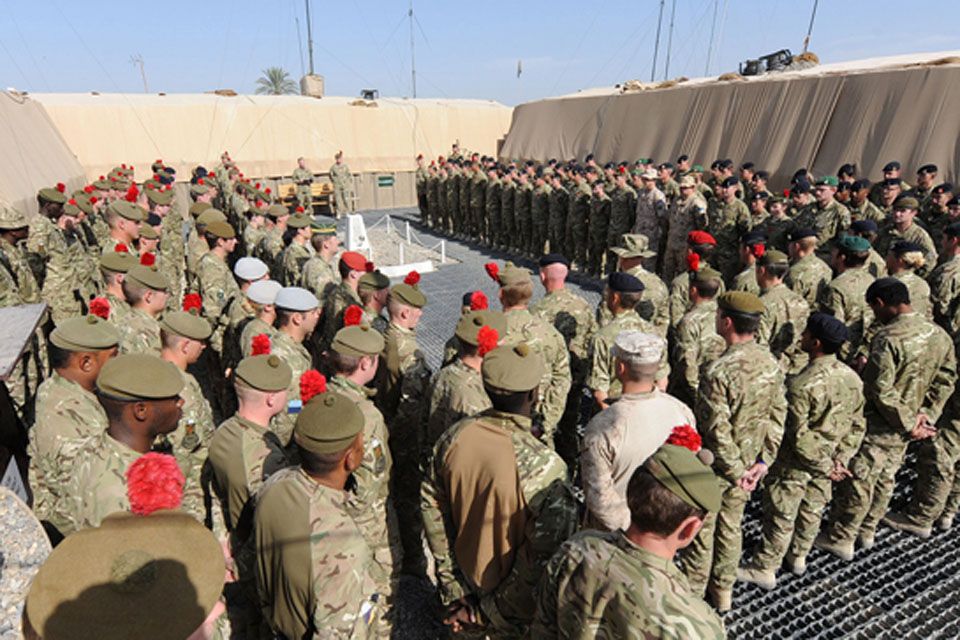 On the front line, at Forward Operating Base Shawqat in Nad 'Ali, Helmand province, soldiers of 3rd Battalion The Royal Regiment of Scotland (The Black Watch) gather in remembrance