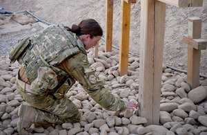 Para Musician Kate Whittaker visits the Cross and Memorial Stone at Camp Bastion in tribute to her brother, Joe, killed in Helmand in 2008