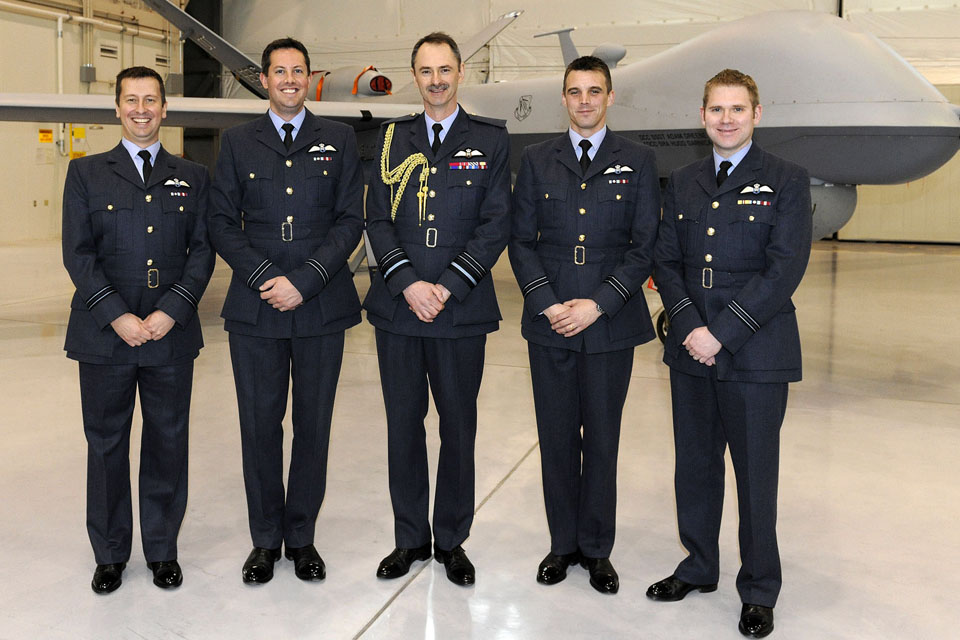 Air Marshal Richard Garwood alongside 4 newly-graduated remotely-piloted aircraft pilots