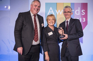Mark Lowcock receives the most improved government body award from Margaret Hodge and Richard Bacon (Chair and Deputy Chair of the Public Accounts Committee).