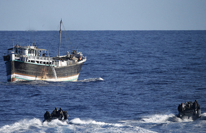 Boats from HMAS Darwin approach a dhow in the Indian Ocean during an operation that recovered over a tonne of heroin whilst on CTF150 operations. Copyright Commonwealth of Australia.