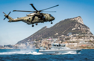 Commando Helicopter Force Merlin Mk3 helicopter and HMS Scimitar in British Gibraltar Territorial Waters. Crown copyright.