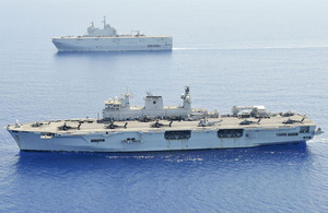 HMS Ocean (foreground) and Marine nationale's Mistral, off the coast of Libya