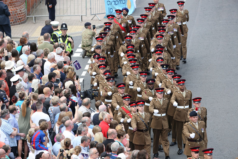 Crowds cheer as the Armed Forces parade in Cleethorpes