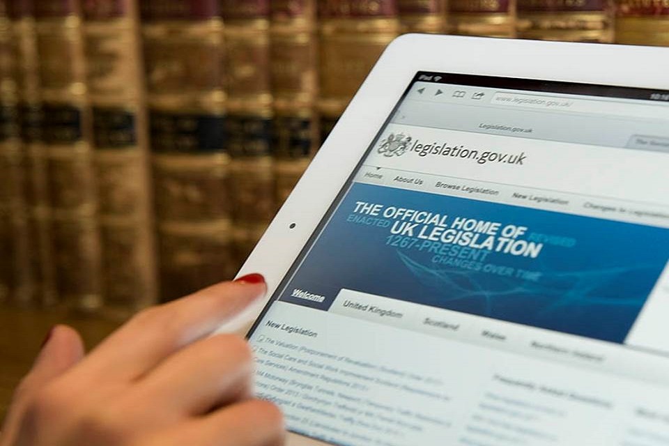 Person browsing legislation.gov.uk on a tablet device.